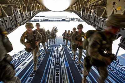 U.S. Army paratroopers assigned to the 82nd Airborne Division load onto a C-17 Globermaster III during Large Package Week that happens in conjunction with Joint Operational Access Exercise in Fort Bragg, NC, Oct. 11, 2012. The exercise utilizes several Air Force aircraft to strategically airdrop troops and cargo. (U.S. Army photo)