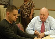 Hector Ramirez works with VA counselor John Thompson.