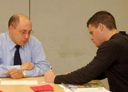 VA counselor Patrick Zondervan works with OIF Veteran Travis Shrum.