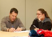 VBA Veterans Service Center Team Leader Pete Veitenhans and OIF Veteran Rachel Ahner working on forms.