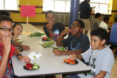 Fruit and Veggie Ambassadors sampling fresh fruit and vegetables at a Pawtucket Summer Food Service Program.