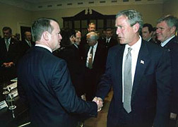 President George W. Bush greets Qwest Communications Chairman and Chief Executive Officer Richard Notebaert 