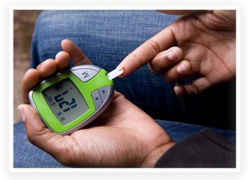 A diabetic woman tests her blood sugar levels