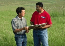 An NRCS employee helps a landowner with conservation planning.