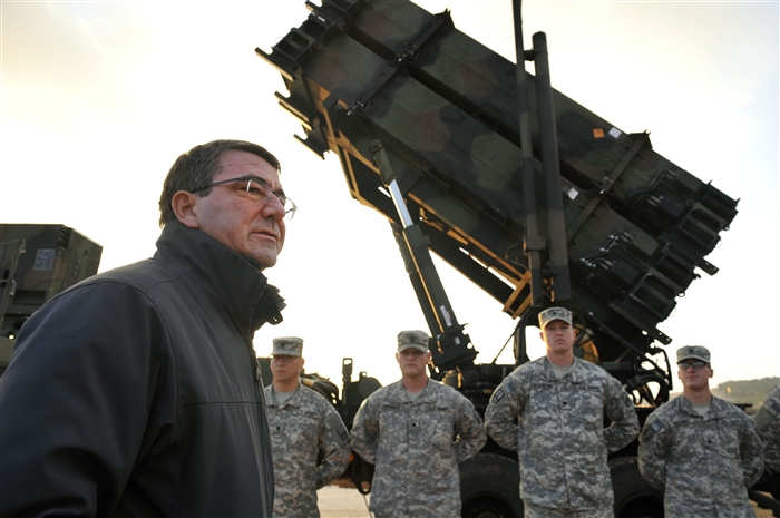U.S. Deputy Secretary of Defense Ashton B. Carter, left, speaks to U.S. Service members upon his arrival at a Turkish army base in Gaziantep, Turkey, Feb. 4, 2013. Carter was visiting the area to view Patriot missile batteries installed with assistance from U.S. troops. U.S. and NATO Patriot missile batteries and personnel deployed to Turkey in support of NATO's commitment to defending Turkey's security during a period of regional instability. 