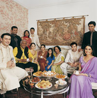 Photo: Large Indian family sitting around table