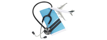 Photo: Stethoscope, passport and toy plane