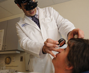 Doctor examining a patients eye.