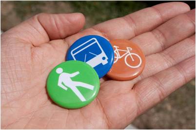 Hand with walking, bus and bike symbol buttons