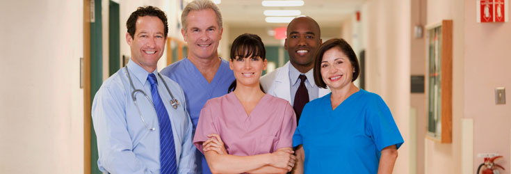 A photo of hospital staff standing in hallway.
