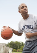 man dribbling a basketball