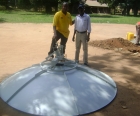Uganda-based Marketing Representative Peter Byengoma helps with satellite installation for new South Sudan affiliate Radio Yambio.