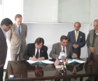 VOA Director David Ensor witnesses Eurasia Marketing Officer Enver Safir sign the RTA (Radio Television Afghanistan) affiliate contract. 