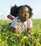 Young girl playing in field