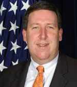  John P. Woods, Associate Director National Security Investigations  Division