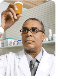 Photo of pharmacist holding a bottle of pills.