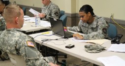 Sgt. 1st Class Vikki Bautista with the 927th Combat Sustainment Suppot Battalion checks the records of a Florida National Guard Soldier at Camp Blanding Joint Training Center prior to departing for Washington D.C. to support the 57th Presidential Inauguration.