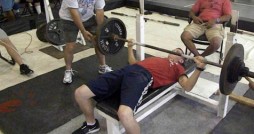 Spc. Joshua Branham bench pressing 165lbs which got him to win his age group for both Armed Forces Championships. Courtesy photo