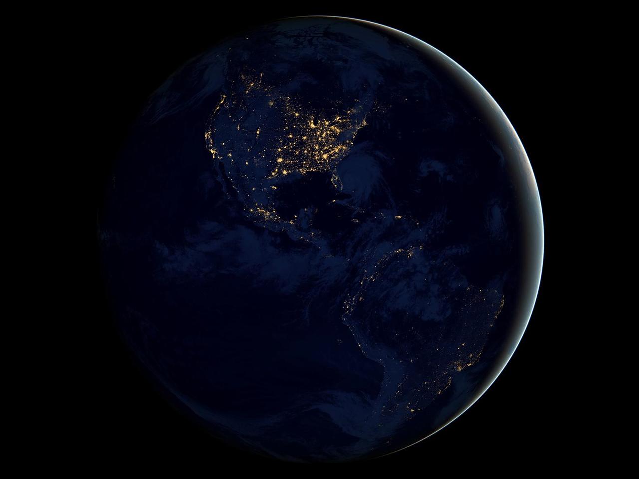Image description: This new global view of Earth&#8217;s city lights is a composite assembled from data acquired by the Suomi National Polar-orbiting Partnership (NPP) satellite. The data was acquired over nine days in April 2012 and 13 days in October 2012. It took 312 orbits to get a clear shot of every parcel of Earth&#8217;s land surface and islands. This new data was then mapped over existing Blue Marble imagery of Earth to provide a realistic view of the planet.
View a larger image.
Image from NASA&#8217;s Earth Observatory/NOAA/DOD