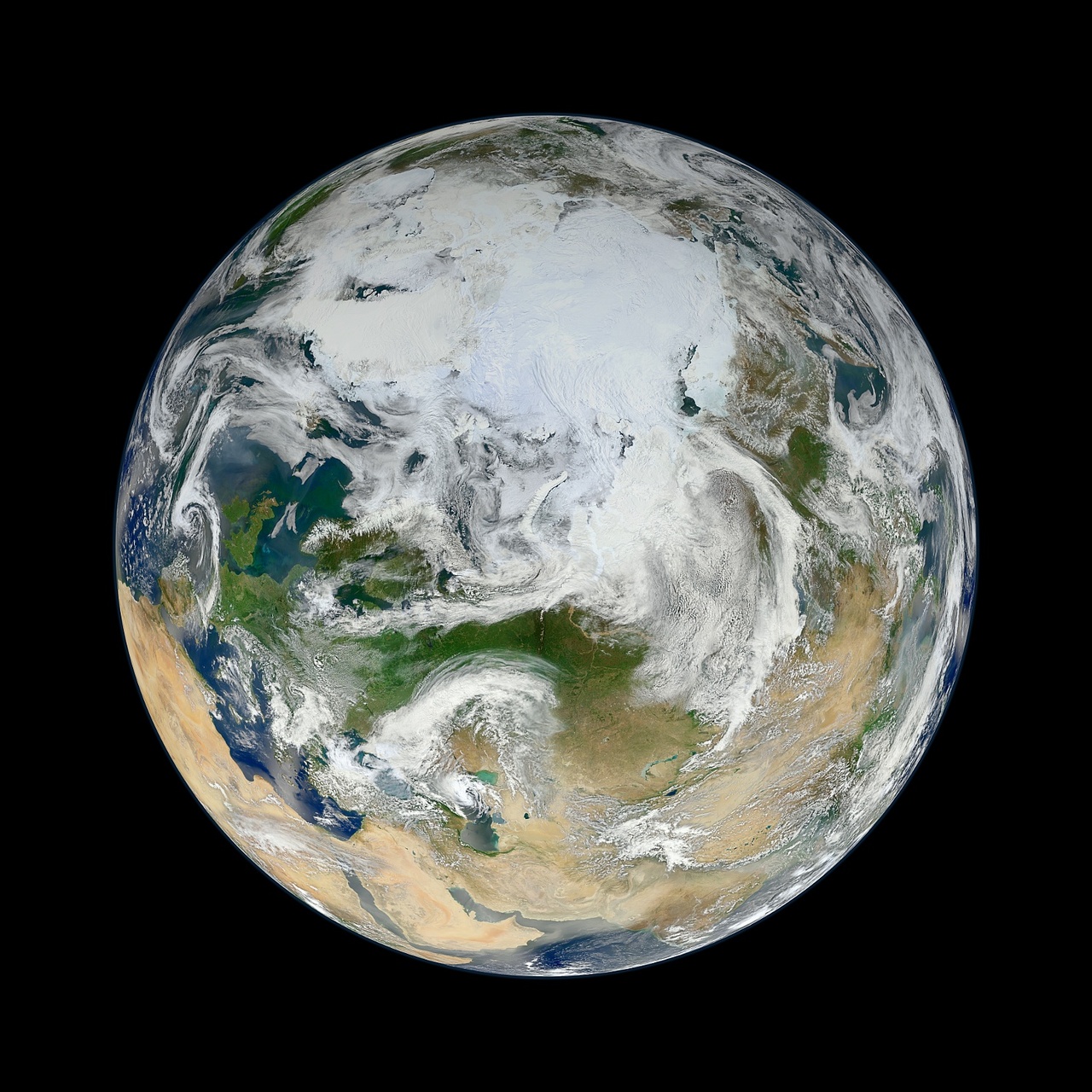 Image description:
From NASA&#8217;s Earth Observatory:
There have been many images of the full disc of Earth from space – a view often referred to as “the Blue Marble” – but few have looked quite like this. Using natural-color images from the Visible/Infrared Imaging Radiometer Suite (VIIRS) on the recently launched Suomi-NPP satellite, a NASA scientist has compiled a new view showing the Arctic and high latitudes.