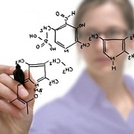 Researcher writing molecular structure