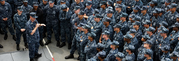 Leader addressing group of service members