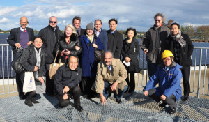 International Trade Administration and Department of Energy employees pose for a photo with trade mission participants and workers from the Tohoku Electric Utility on an observation platform above Matsushima Bay in Japan in December 2012.