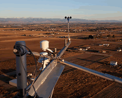 Tower mounted air monitoring equipment.