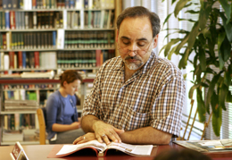 Man reading a book in the Library