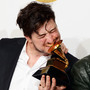 Marcus Mumford of Mumford & Sons, winner of Album of the Year at the 2013 Grammy Awards. To date, the band's winning album, Babel, has sold 1,737,000 copies, according to Nielsen Soundscan.