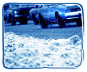 Cars Driving in Wintry Conditions