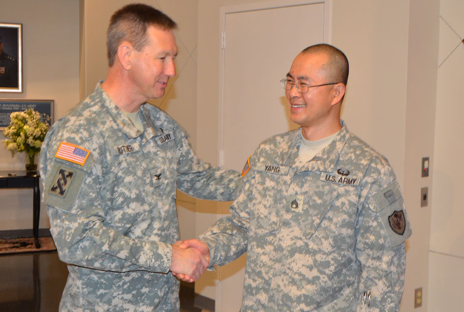 Colonel Rutner congratulates Staff Sergeant Yang