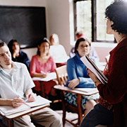 Image of parents in a class room participating teacher's question