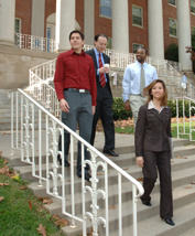 Employees descend the steps of Building 1