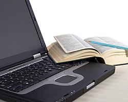 laptop and open book