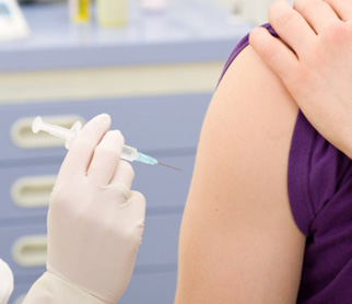 Person receiving vaccine.