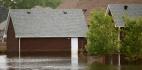 Flood waters rising in a neighborhood of houses