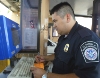Border agent working at a computer