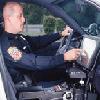 Photo of Police Officer using In-Car Personal Computer