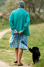 older woman walking with a dog