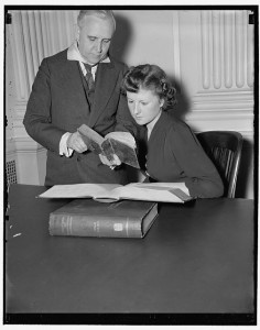 In this picture V. Valta Parma, Curator of the Rare Book Division at Congressional Library, is showing Ethel Hearn the first and present Webster dictionaries, 3/21/38