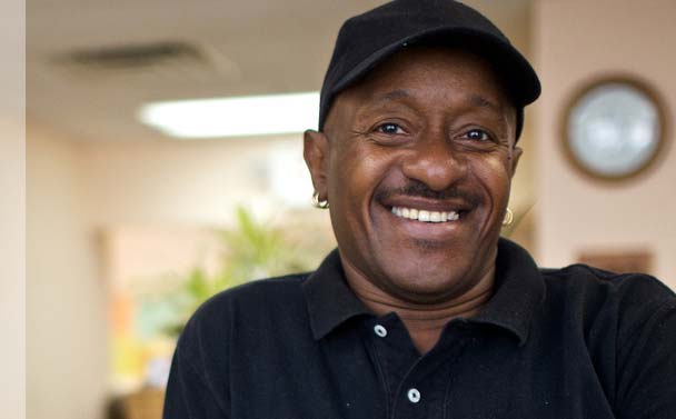 African-American man smiling.