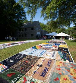 AIDS quilt spread out on a lawn