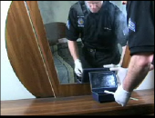 Still image linking toVideo Demonstrating Swabbing a Jewelry Box