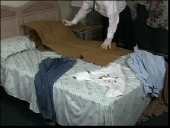 Still image linking toVideo Demonstrating Wrapping a Clothing Item Containing Biological Evidence