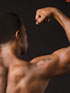 Poster of African American male facing backwards with arm flexed