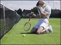 Photo of man exhausted from playing tennis.