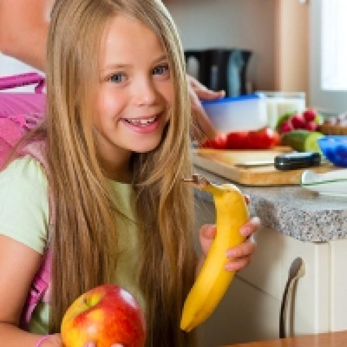 Girl holding fruit