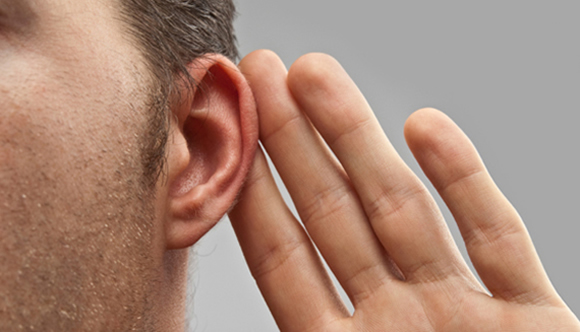 Photo of Man's Ear with cupped hand