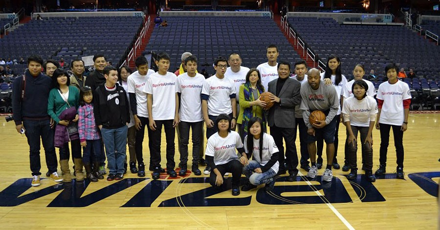 Under Secretary of State for Public Diplomacy and Public Affairs Tara D. Sonenshine and Ambassador Than Swe pose for a photograph with Burmese youth participating in a SportsUnited exchange program at the Verizon Center in Washington, D.C., January 8, 2013. [State Department photo/ Public Domain]